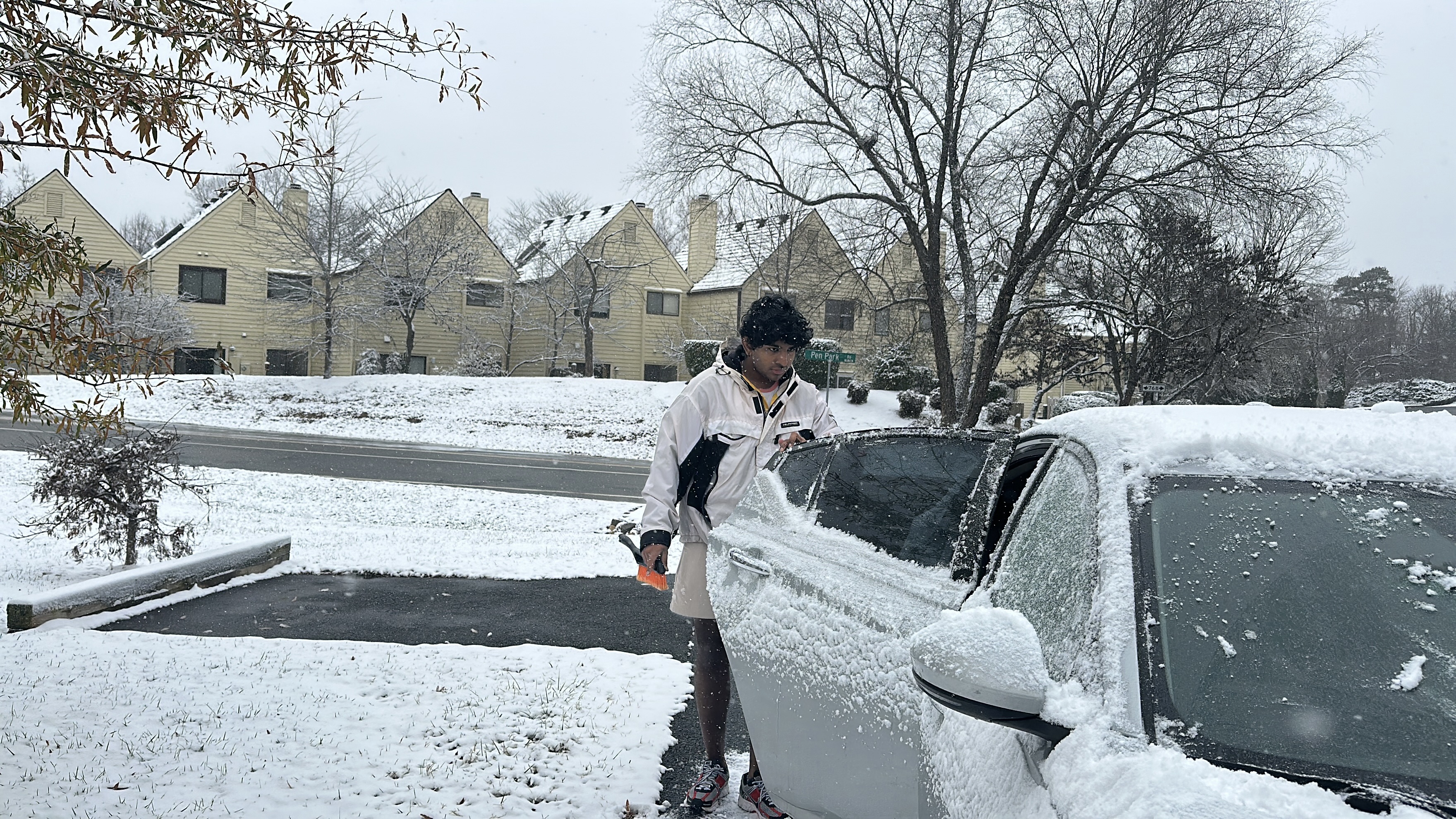 Sam in the snow with the car