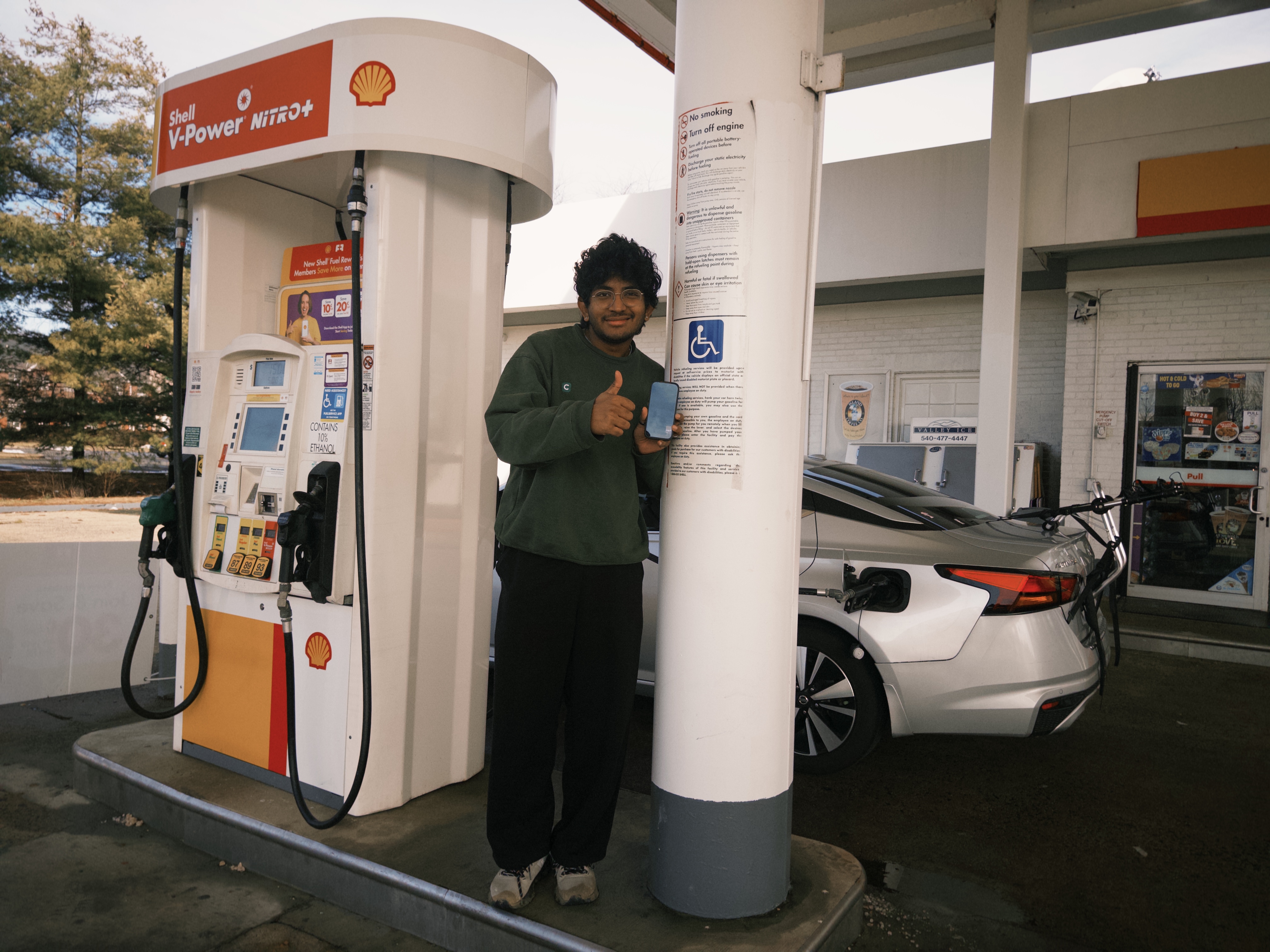 Sam with the car at a gas station